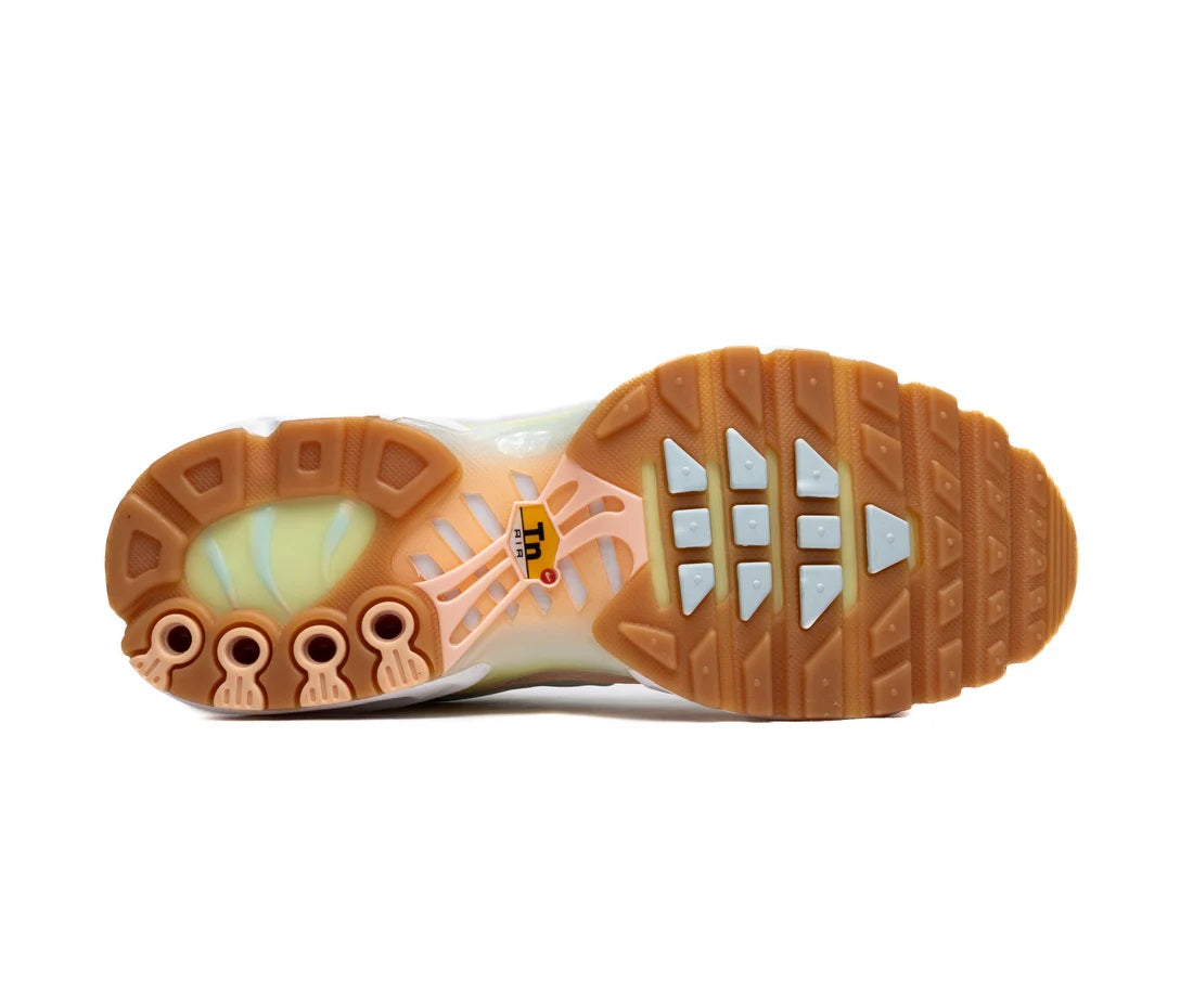 Nike Air Max Plus sneaker outsole, white tread with brown rubber and traction grooves