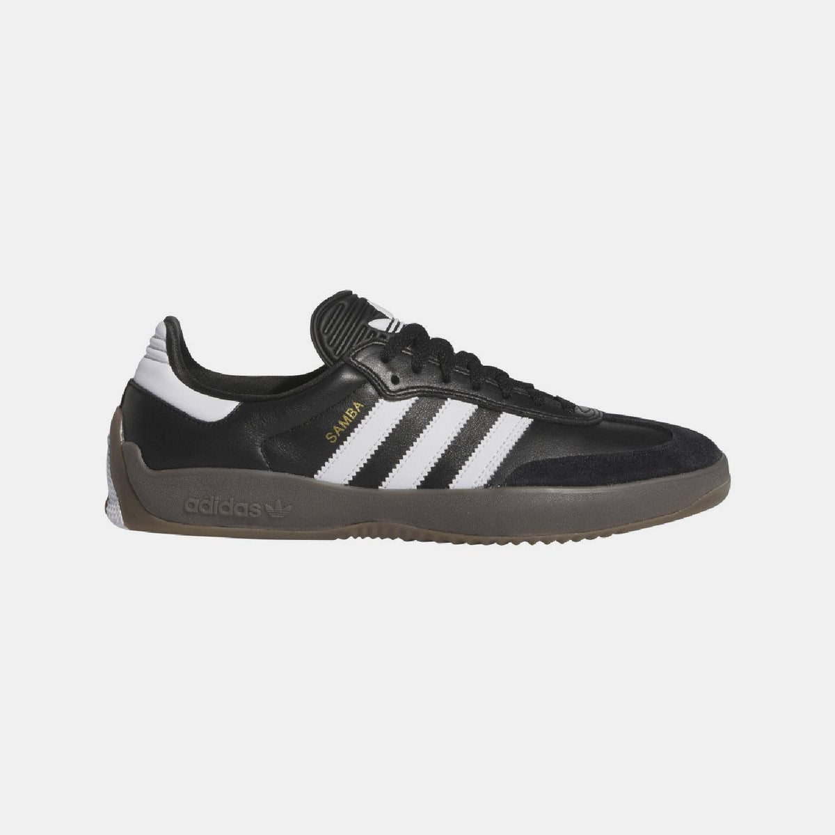 Black low-top trainers with white triple stripes and brown gum sole