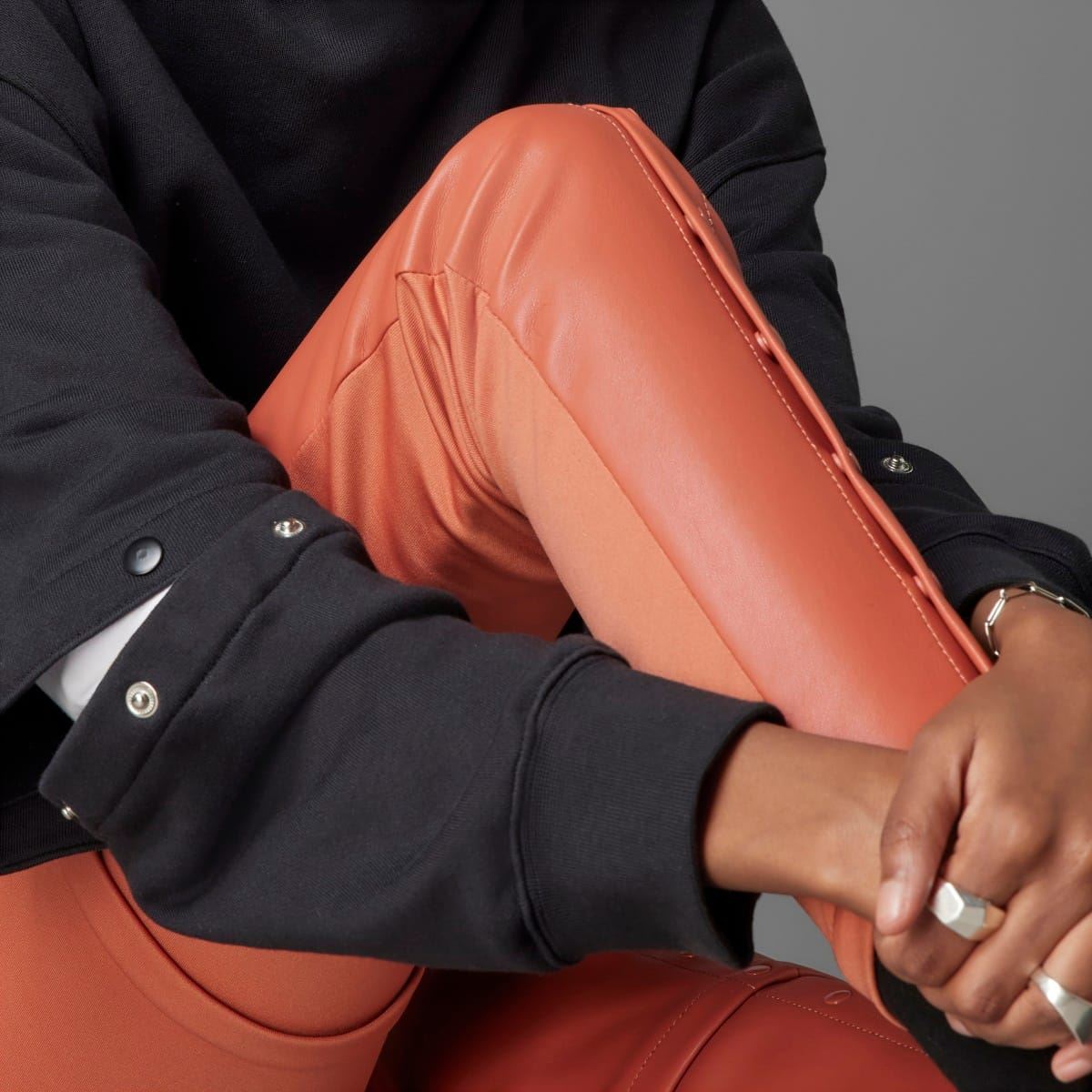 adidas Originals slim fit trousers with tapered design, featuring classic branding and comfortable fabric for casual wear