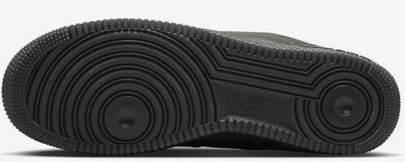 Men's sneaker outsole with textured rubber tread and circular traction pattern