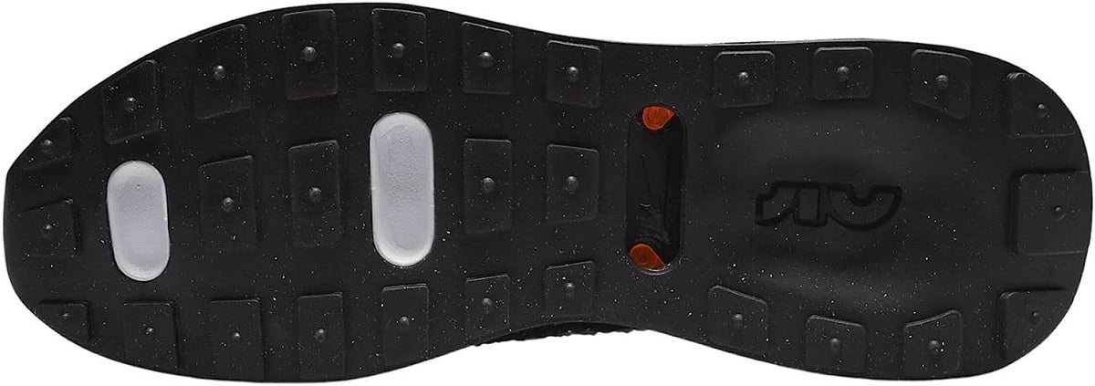 Rubber shoe outsole with black tread and two white oval traction slots