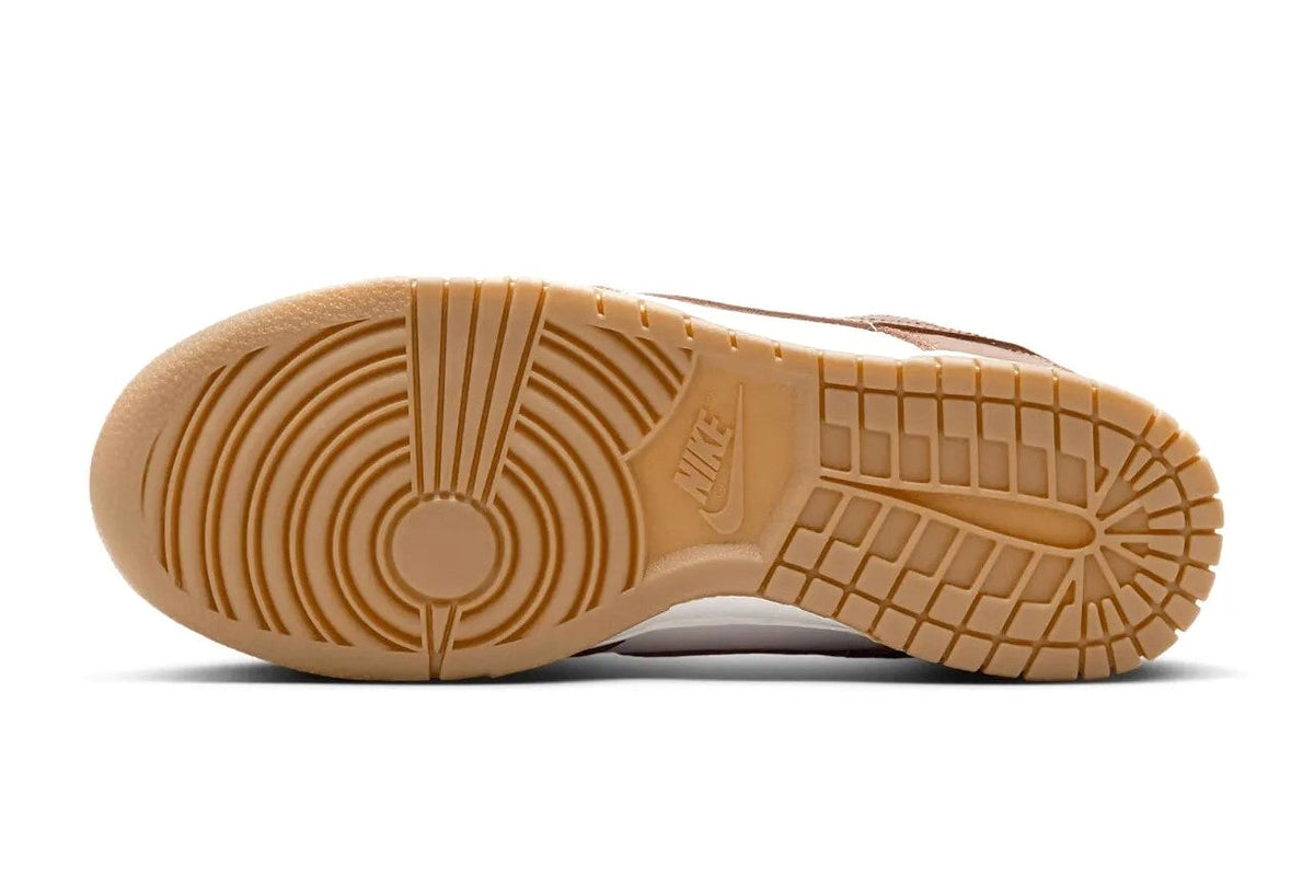 Women's Nike Dunk Low LX sneakers, outsole view with tan gum tread