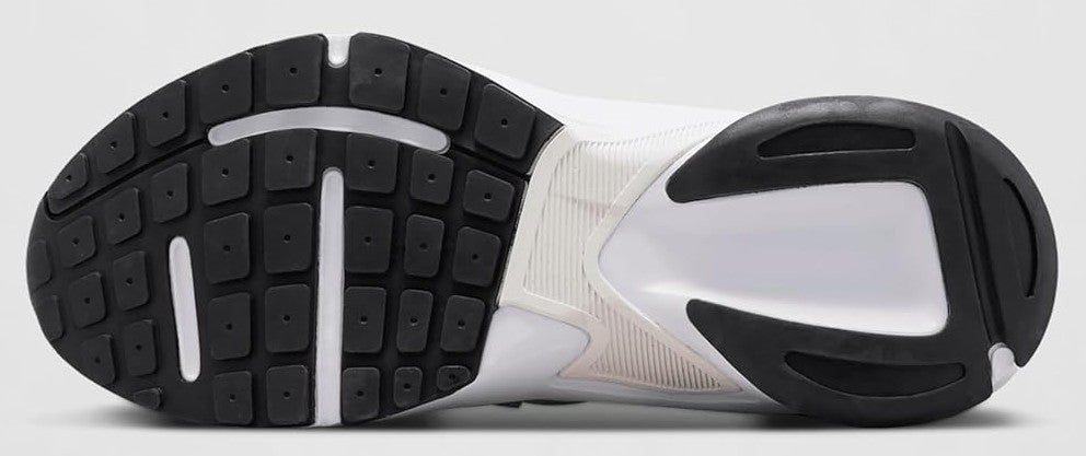 Nike sneaker outsole with black traction pods and white midsole edge