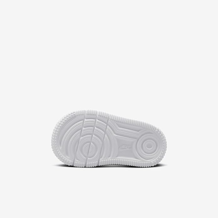Toddler white sneakers outsole with textured tread and circular traction pods