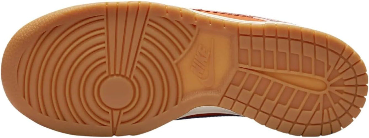Nike Dunk Low SE rubber outsole with brown traction pattern and side grooves