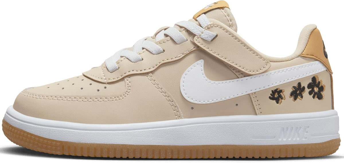 Kids' Nike Force 1 Low lace-up sneakers in tan, white, and dark details, gum sole