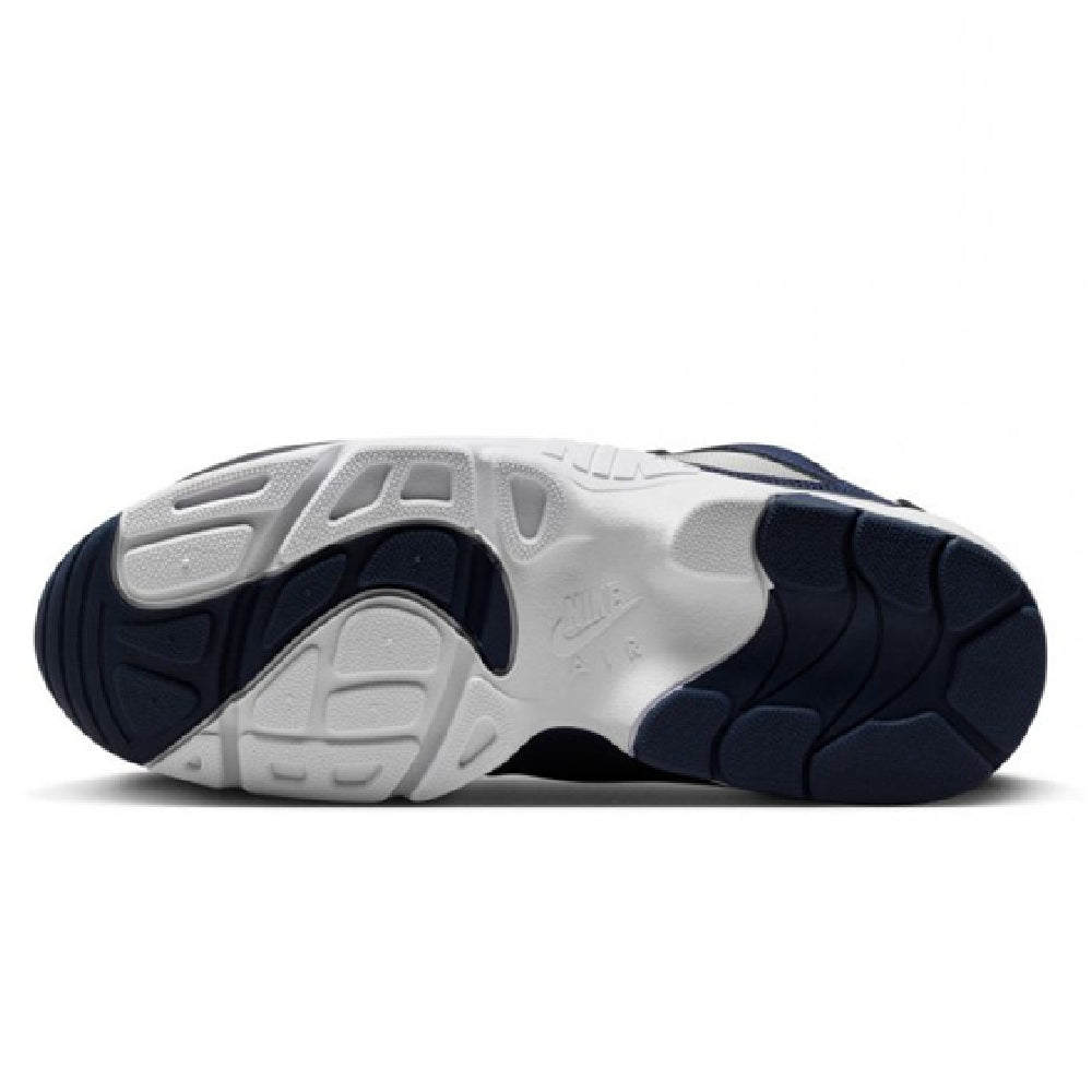 Nike Air Diamond Turf outsole view, white and navy rubber traction