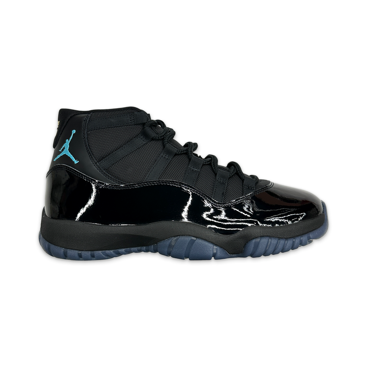 Air Jordan 11 Retro sneaker with black patent toe, mesh upper, blue Jumpman, and blue outsole