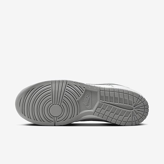 Nike Dunk Low QS outsole view, gray rubber traction sole with circular tread pattern.