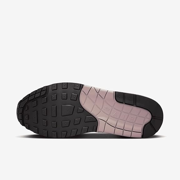 Light pink sneaker outsole with dark traction pods and pink forefoot panel