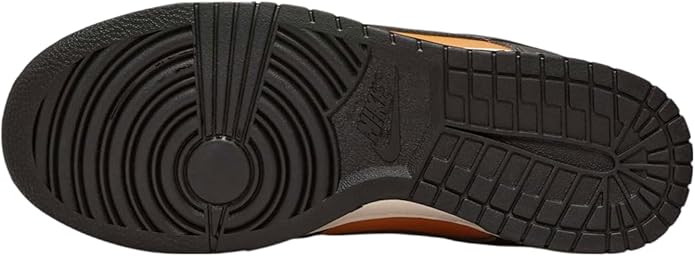 Black rubber outsole with tread grooves and circular traction pattern