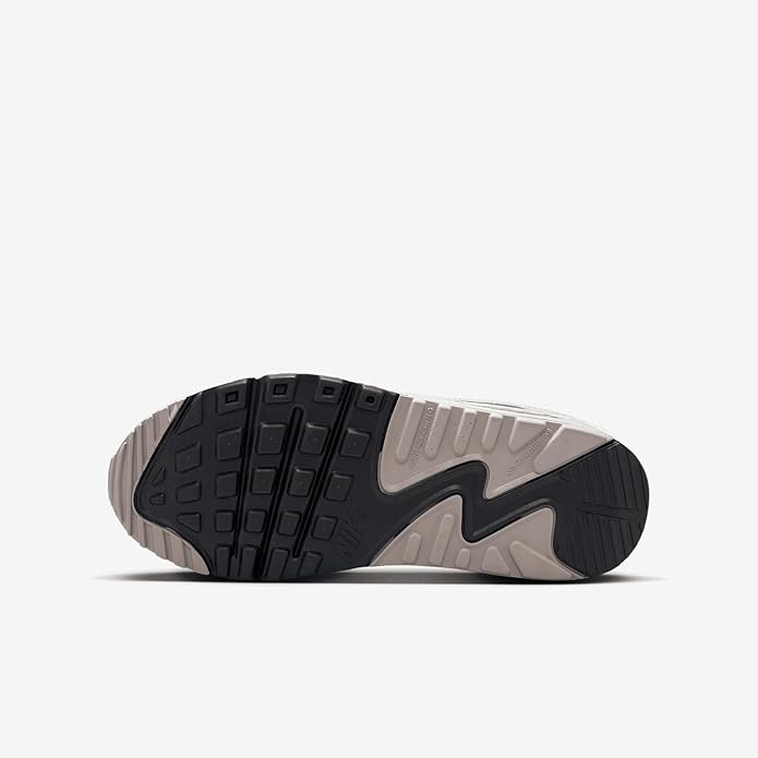 Big kid's Nike Air Max 90 sneaker outsole with dark tread pattern and gray heel