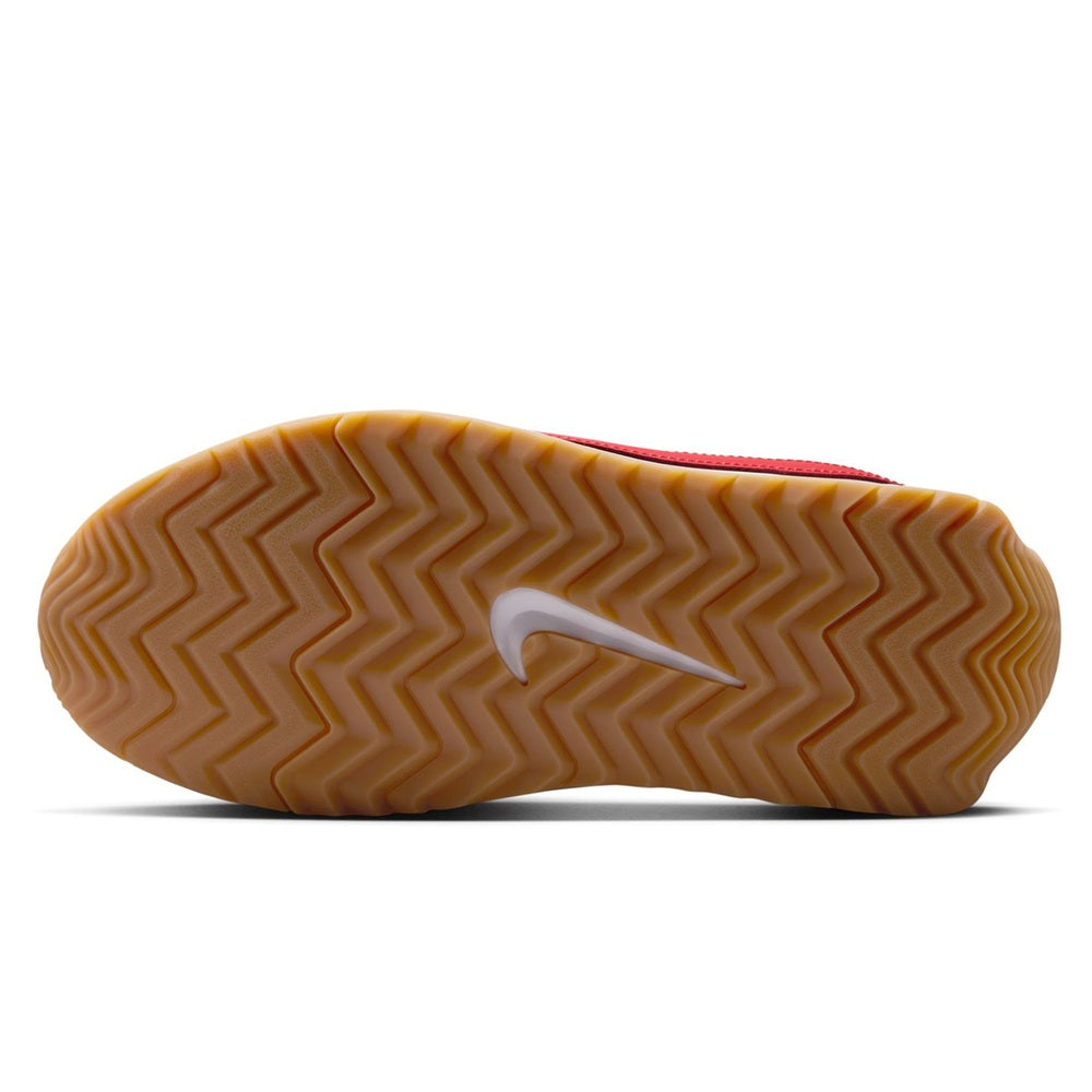 Nike sneaker outsole with zigzag tread on gum rubber base and red edge trim