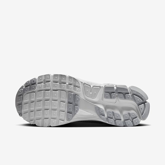Nike Zoom Vomero 5 outsole view, light gray and white tread with rubber pods