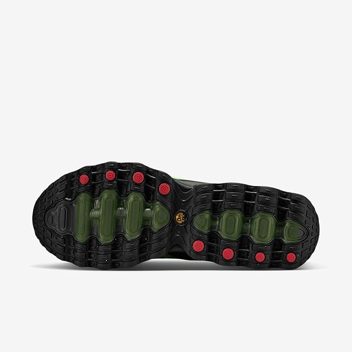 Nike Air Max DN8 running sneaker outsole tread with green air pods and red accents