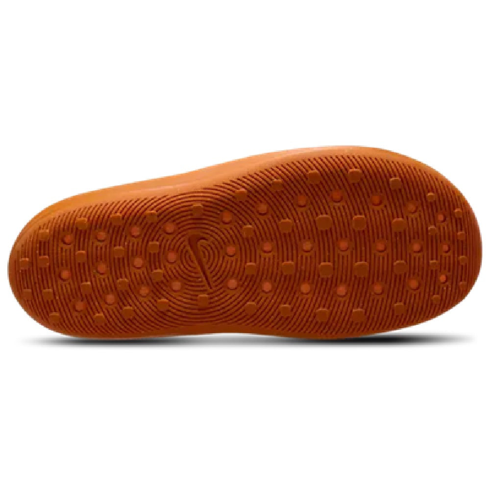 Orange Nike slide sandal outsole with patterned traction tread