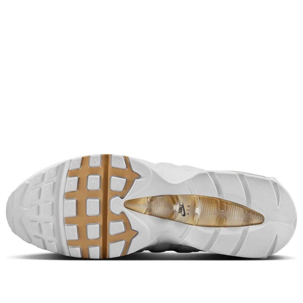 Men's white Air Max 95 OG sneaker outsole with gold tread detail and air cushioning