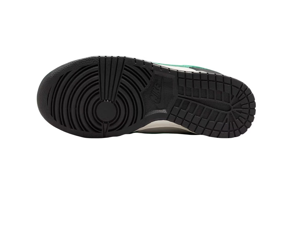 Nike Dunk Low outsole in black with tread pattern and green heel accent