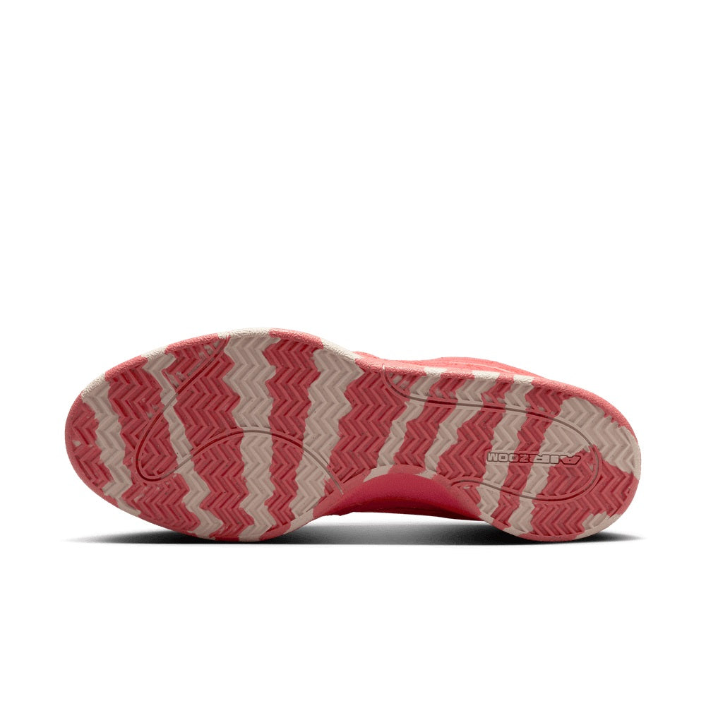 Red men's Nike sneakers outsole view with zigzag traction pattern