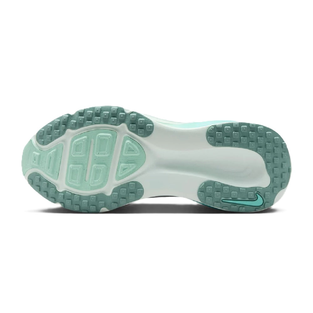 Women's running sneaker outsole view with textured tread in white and turquoise