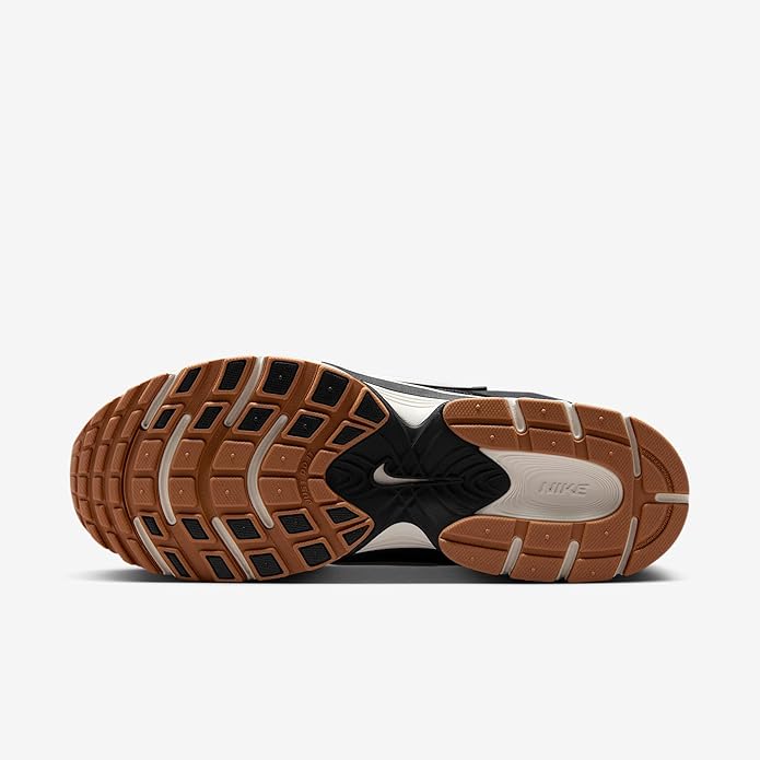 Nike men's running shoes, outsole view: treaded gum-brown rubber with white details