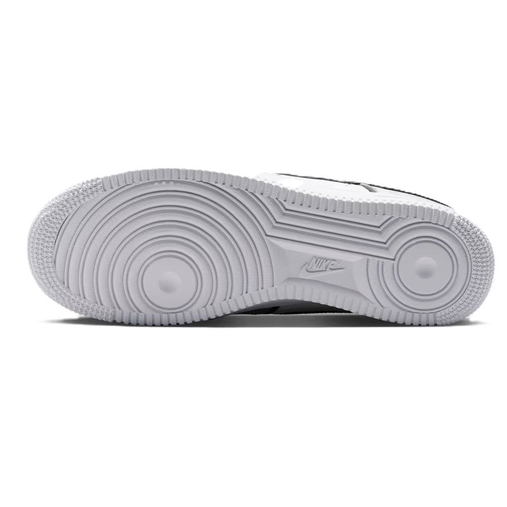 Nike Air Force 1 outsole view, textured rubber tread in light gray