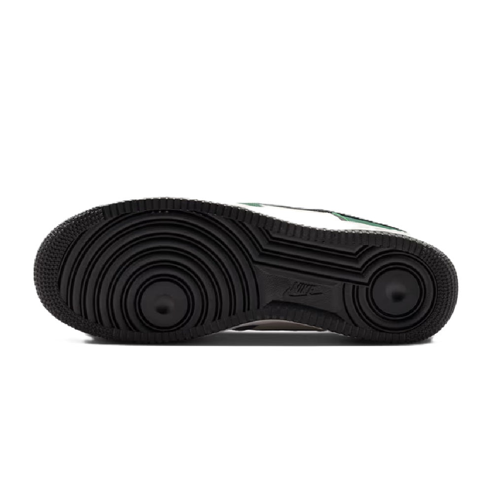 Nike low-top sneaker outsole with black rubber tread and circular traction pods
