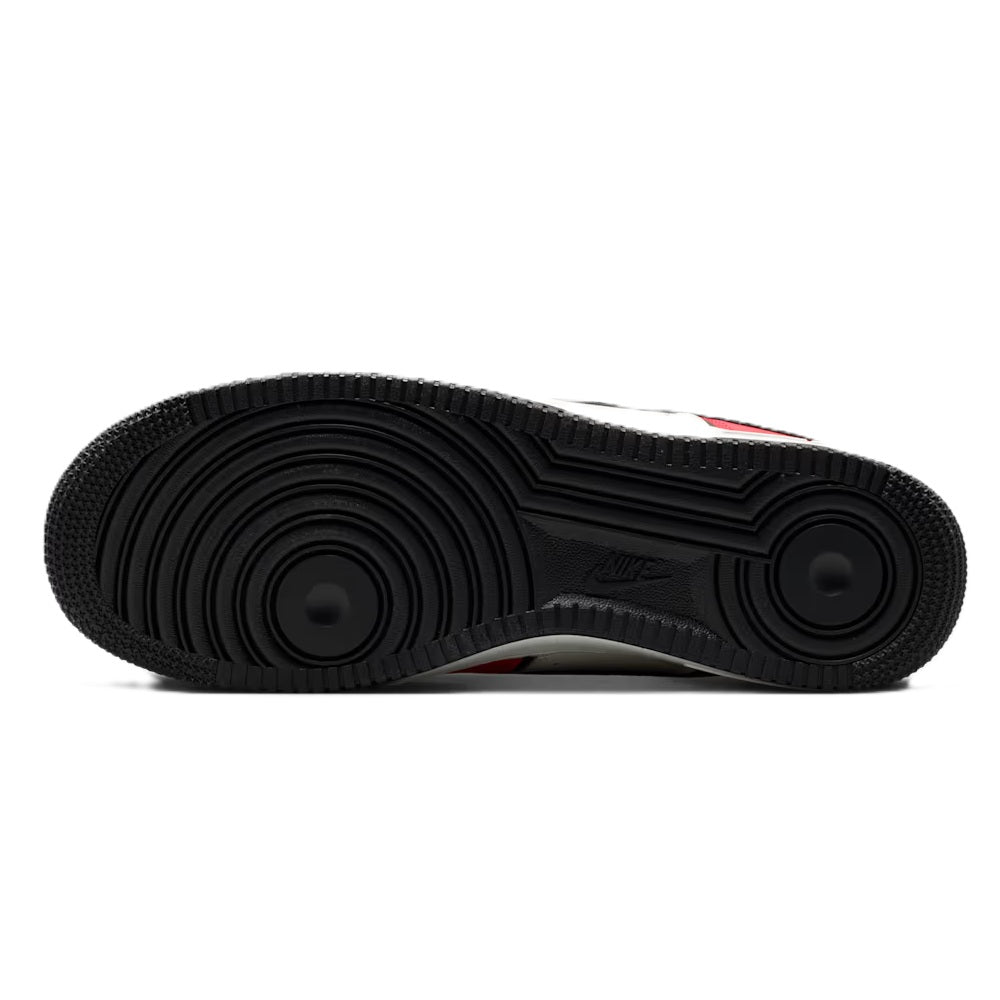 Black rubber outsole with traction pattern for Nike low-top sneakers.