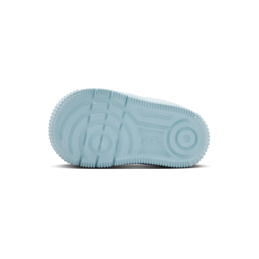 Toddler light blue sneaker outsole with textured traction and circular tread detail