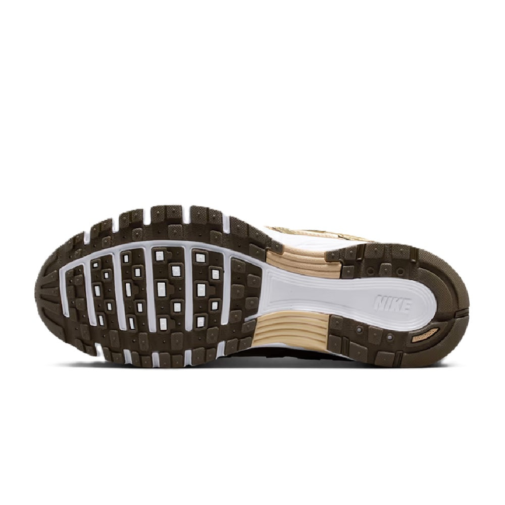 Nike P-6000 sneaker outsole with tread and white midsole, dark rubber forefoot