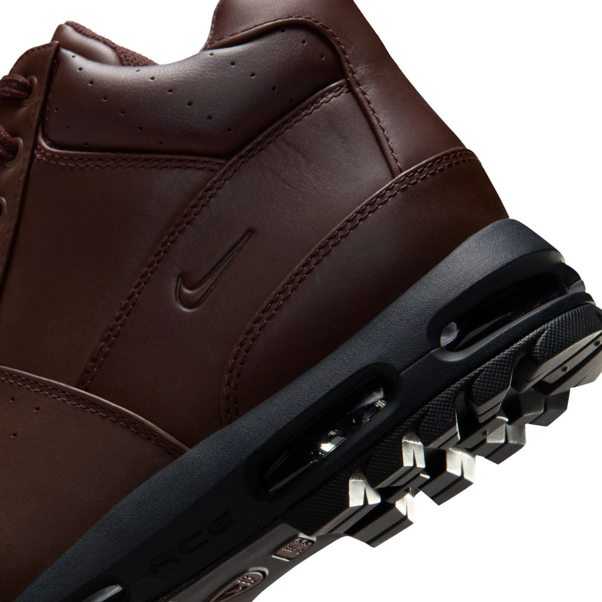 Nike high-top sneaker close-up, dark brown upper and air-unit sole