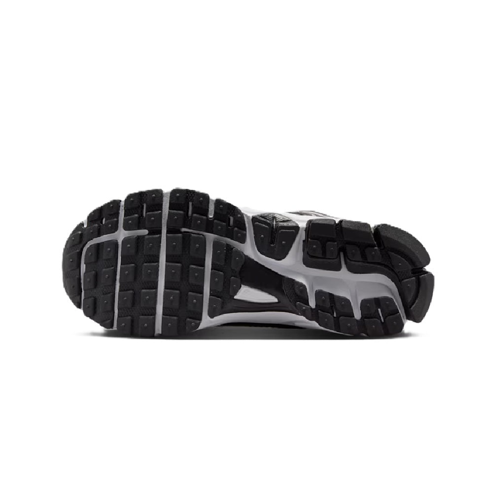 Big kid Nike Vomero 5 outsole, black rubber tread with white midsole