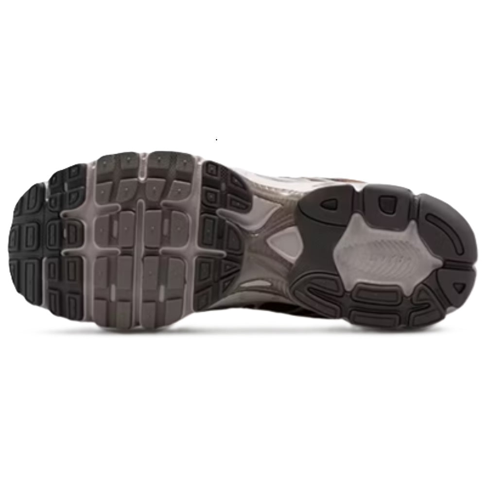Nike sneaker outsole with traction tread and gray/black heel support