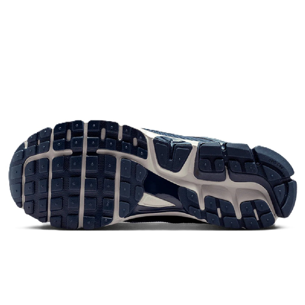 Men's Nike Zoom running shoe outsole view with dark tread and white midsole edge