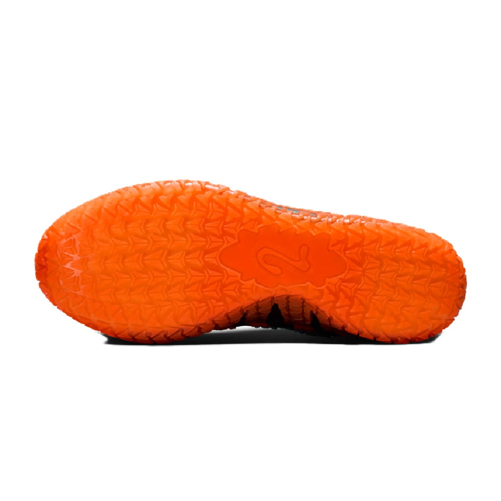 Orange textured rubber outsole with molded traction pattern for basketball sneaker