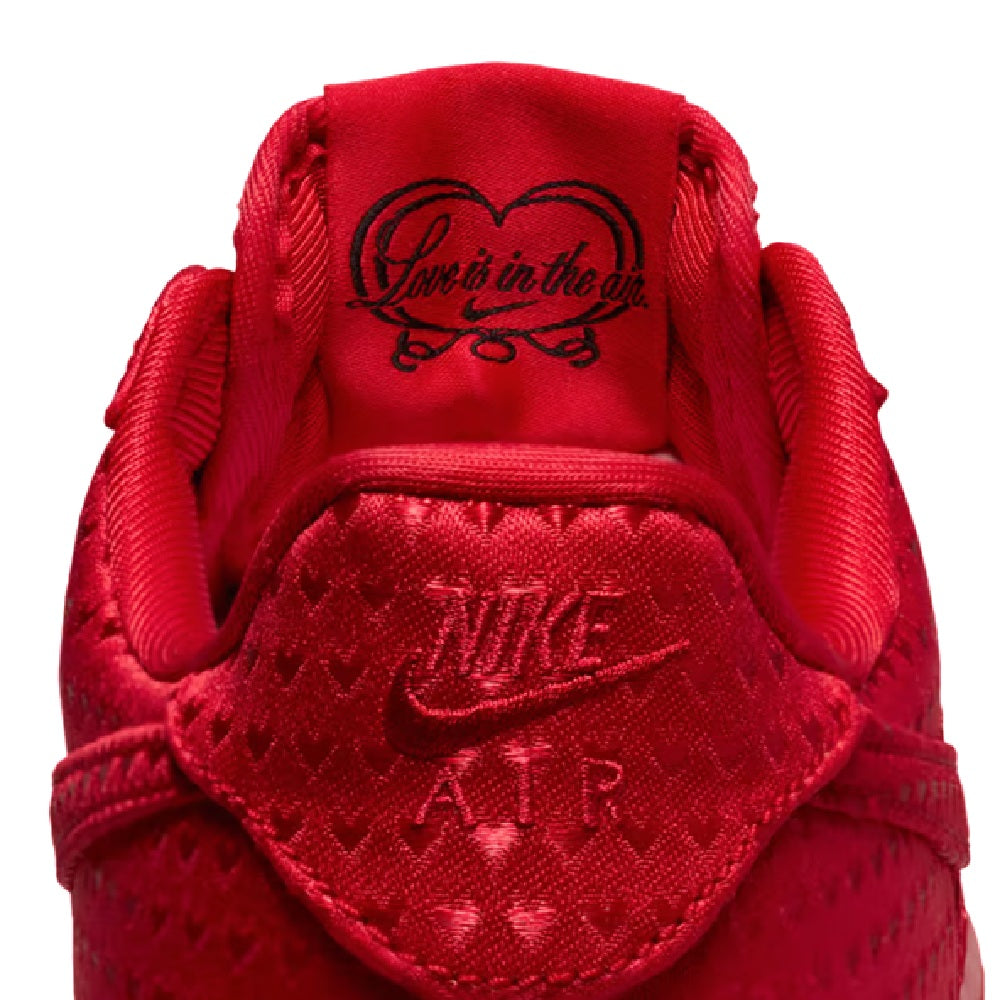 Red Nike Air Force 1 sneakers, close-up of padded insole and heel branding