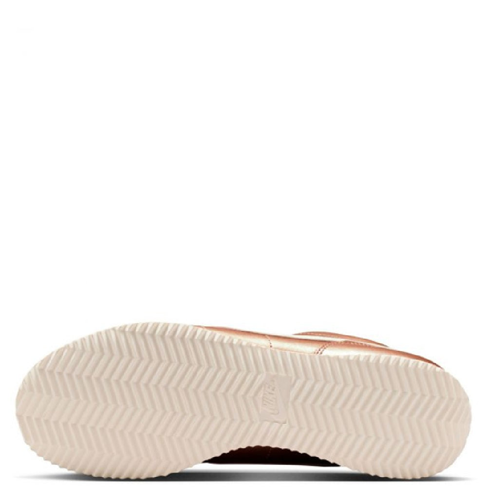 Nike Cortez MTLC sneaker outsole with textured rubber tread, light cream color