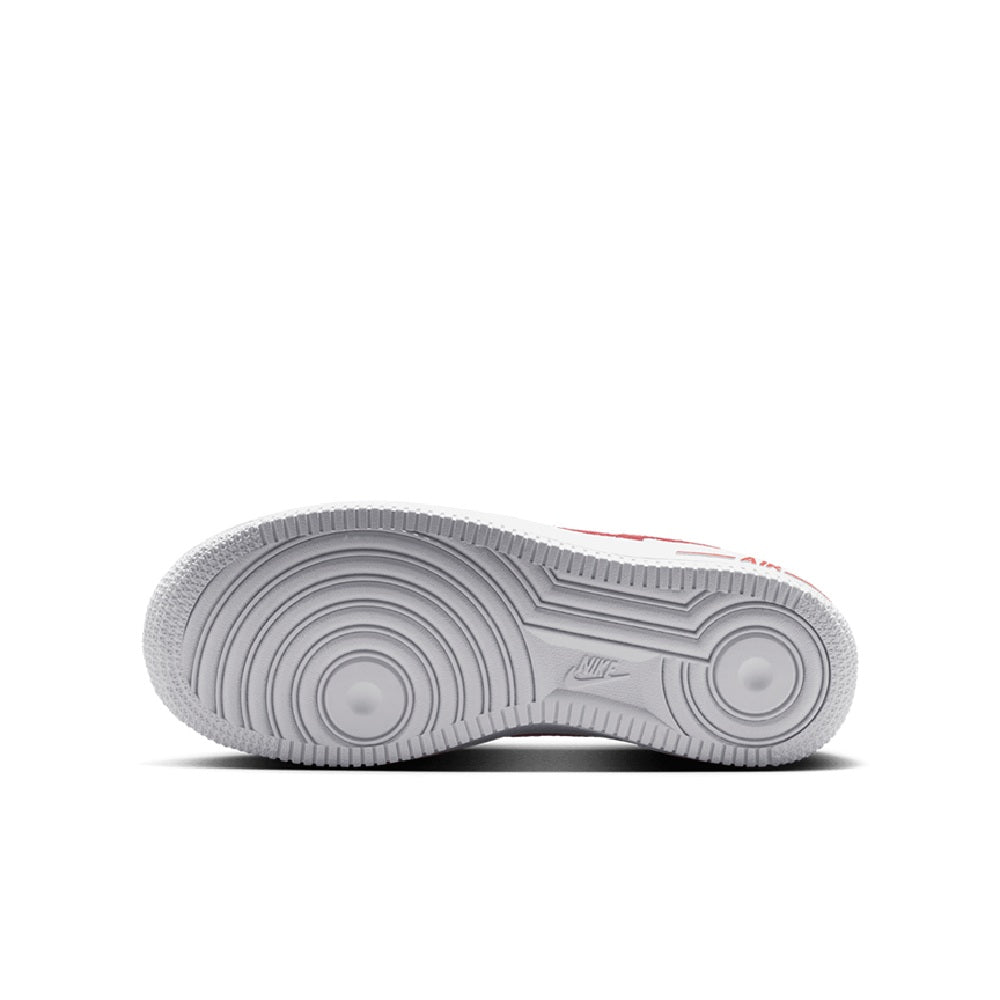 Kids low-top sneaker outsole with textured rubber tread and circular traction pattern