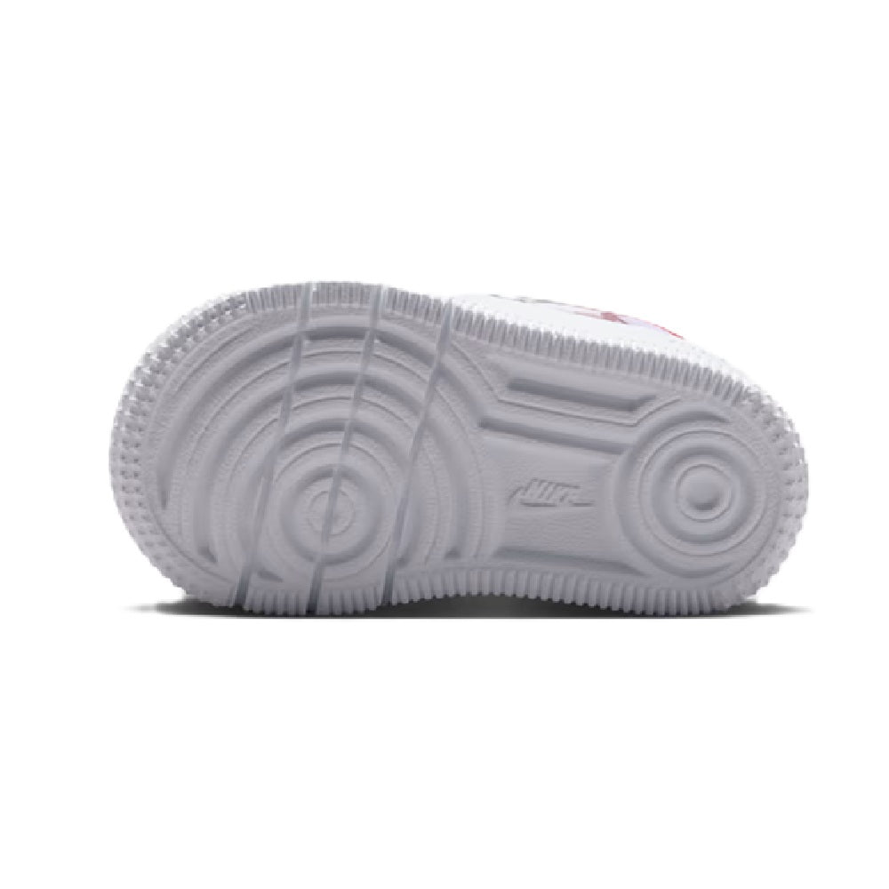Kids sneaker outsole view with textured tread and white rubber sole, light grey upper edge