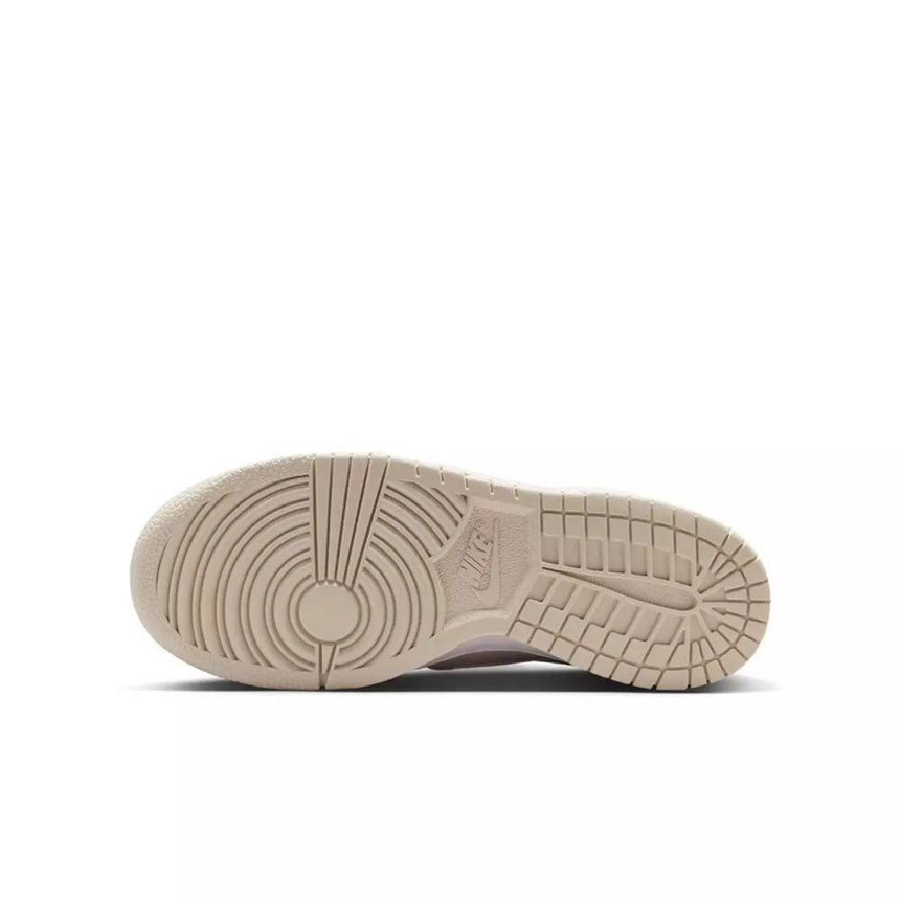 Kids' Dunk Low outsole view with tread and sidewall branding on light beige rubber