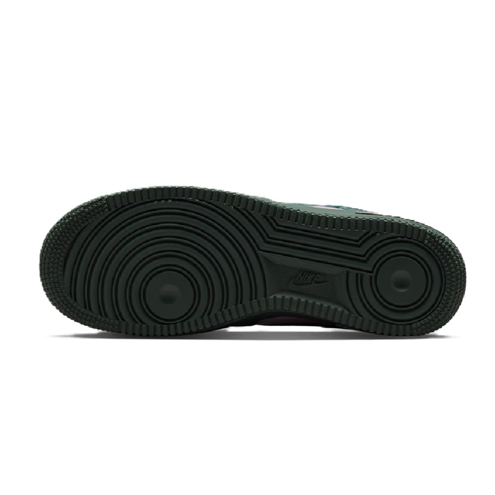 Green sneaker outsole with circular traction tread pattern