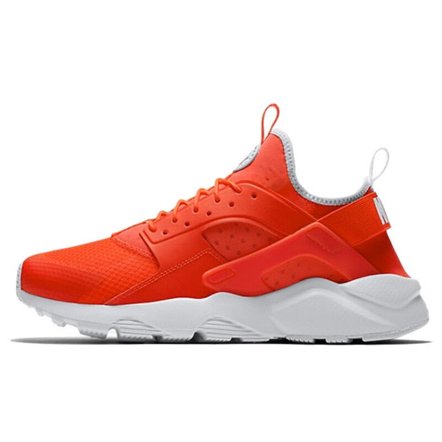 NIKE running shoe in bright orange with white midsole and dark outsole
