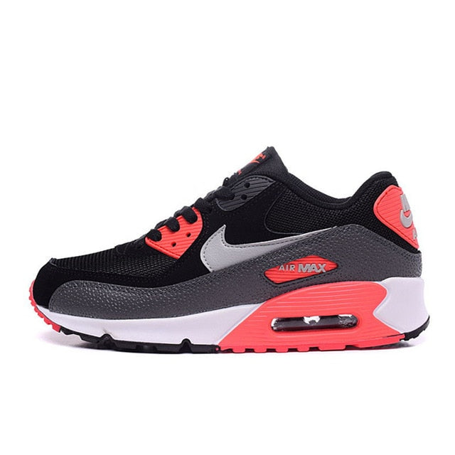 NIKE Air Max 90 running shoes in black with orange accents and Air Max window