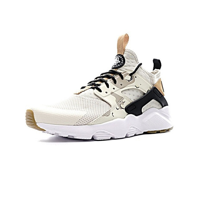 NIKE AIR HUARACHE running shoes, side view in white with black and tan