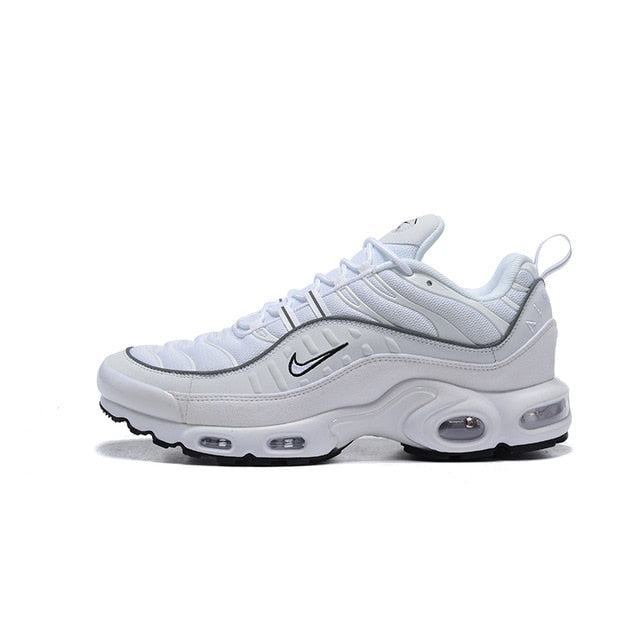Light gray running shoes with black swoosh and Air unit window detail