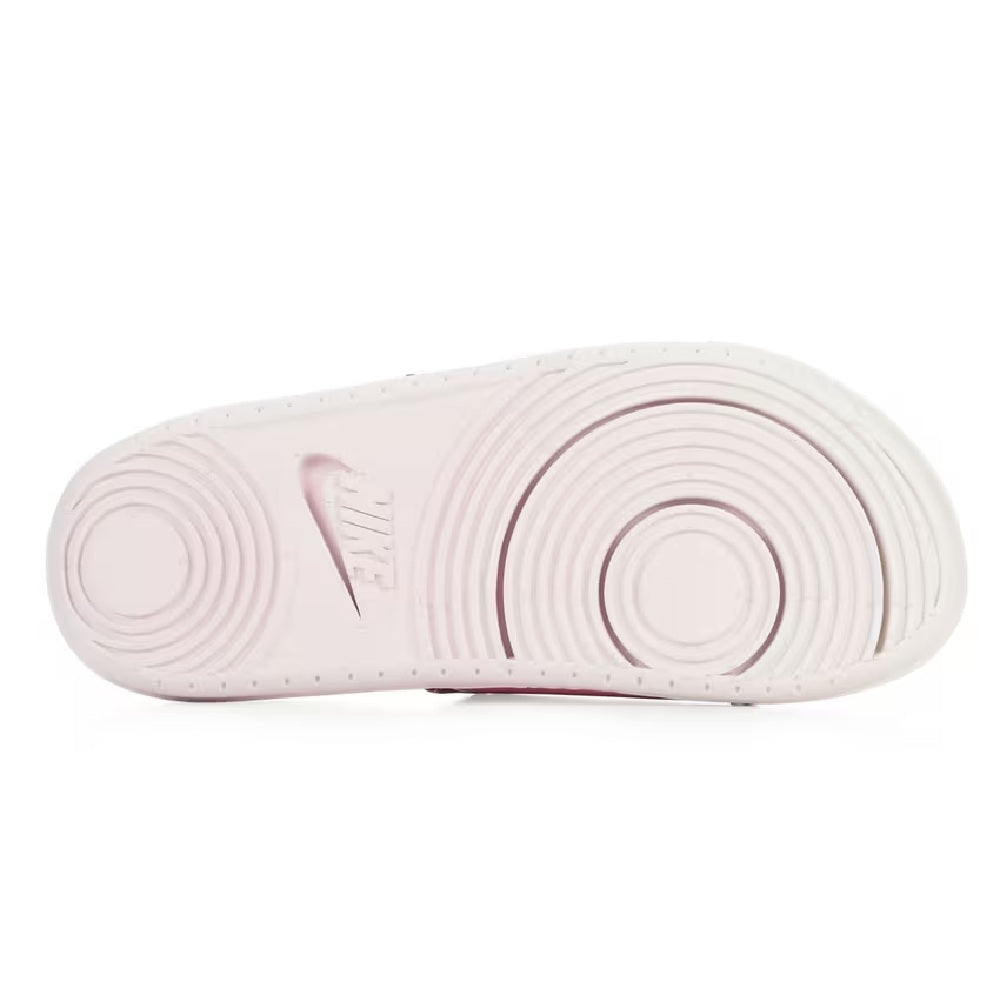 Nike Offcourt slide outsole view with circular tread pattern on white sole
