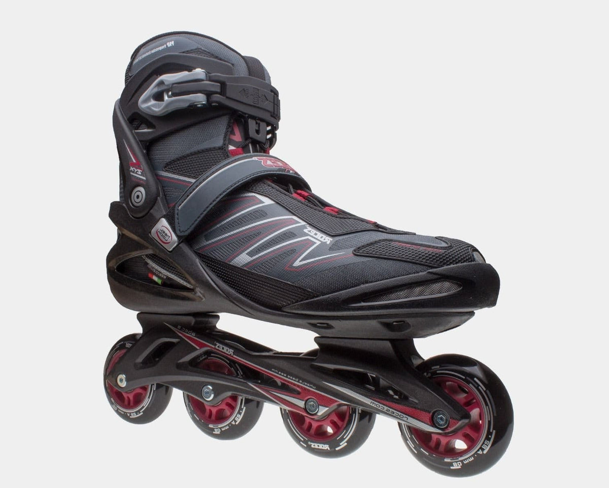 Inline skates side view, dark boot with gray pattern, red wheel set.