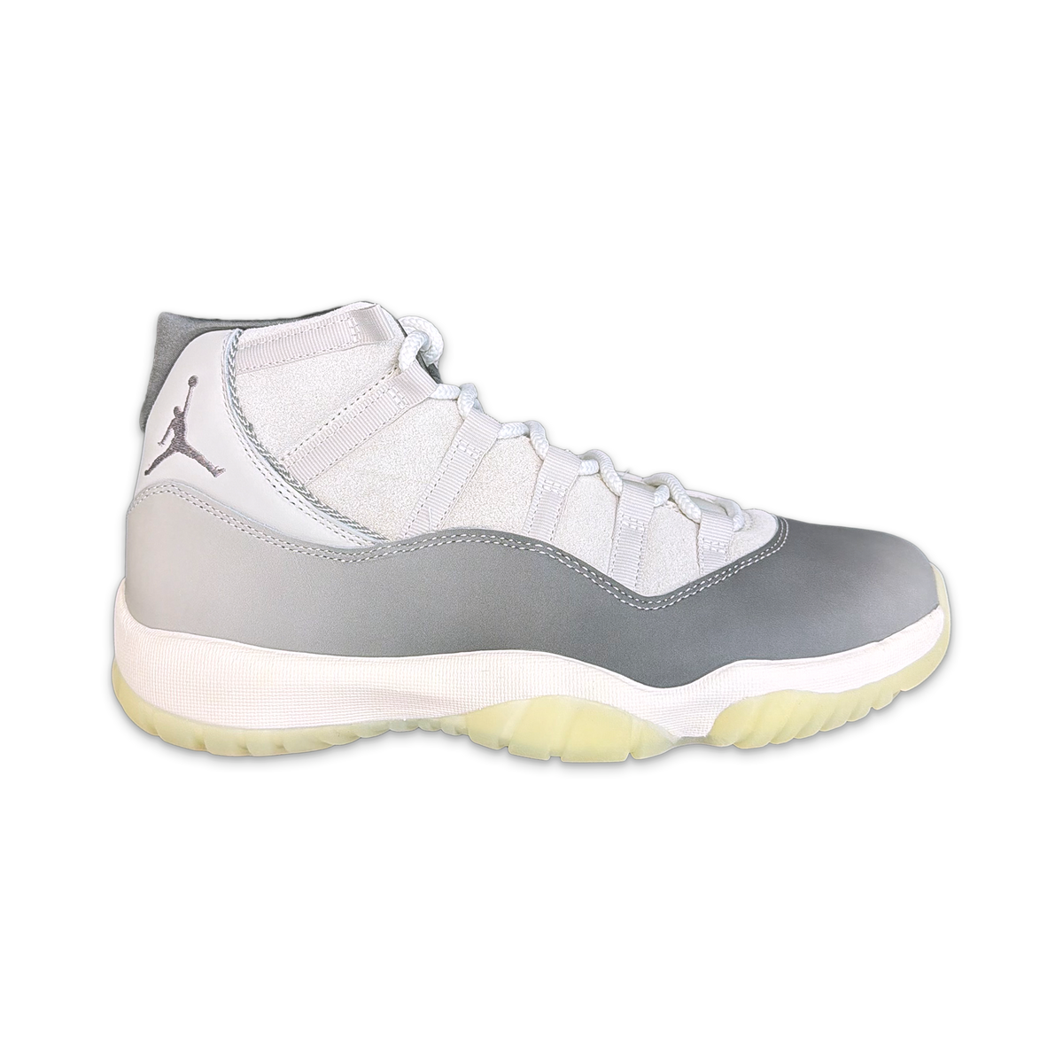 Air Jordan 11 Retro high-top sneaker in white and gray with Jumpman logo