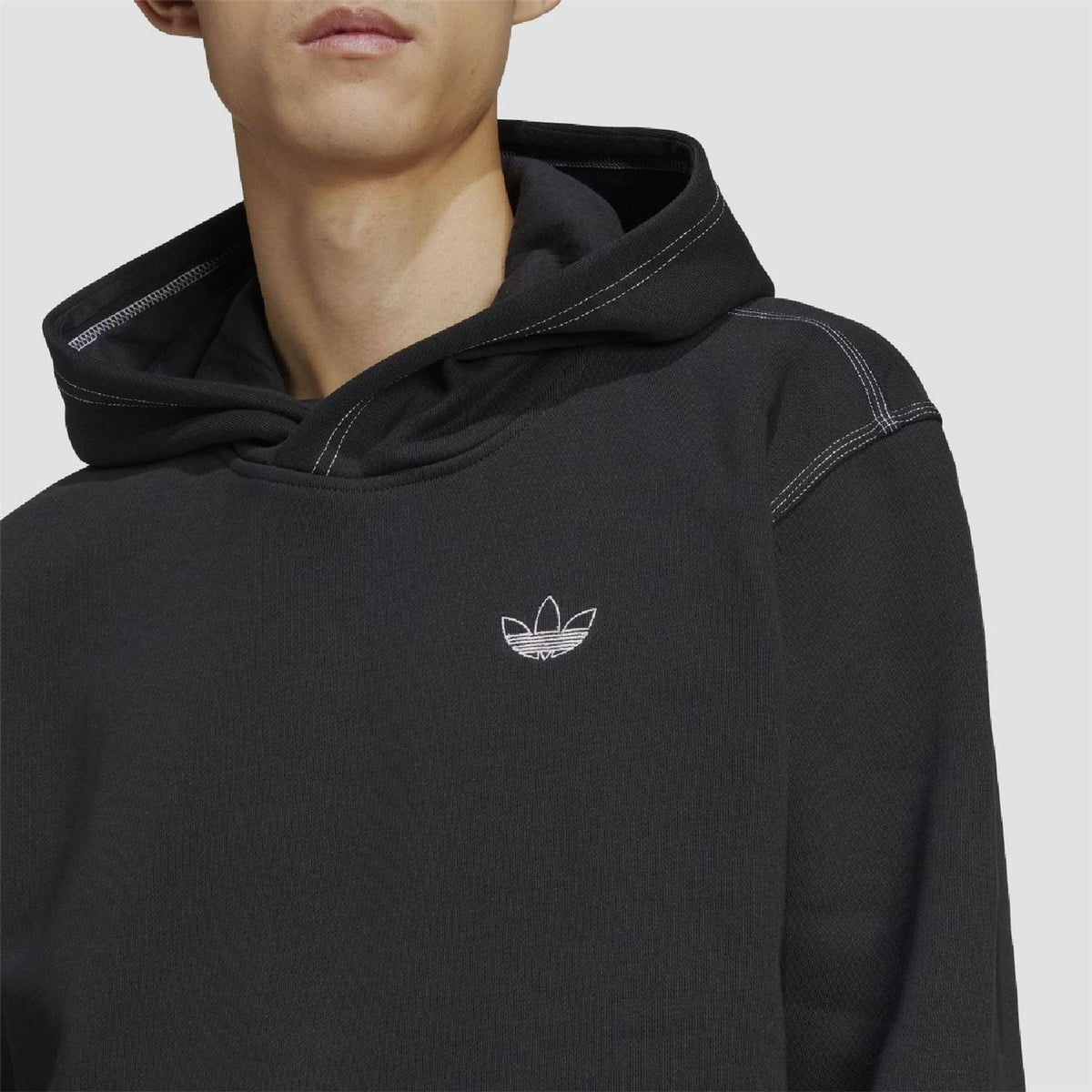 Black adidas Originals hoodie with small trefoil logo on chest and drawstring hood