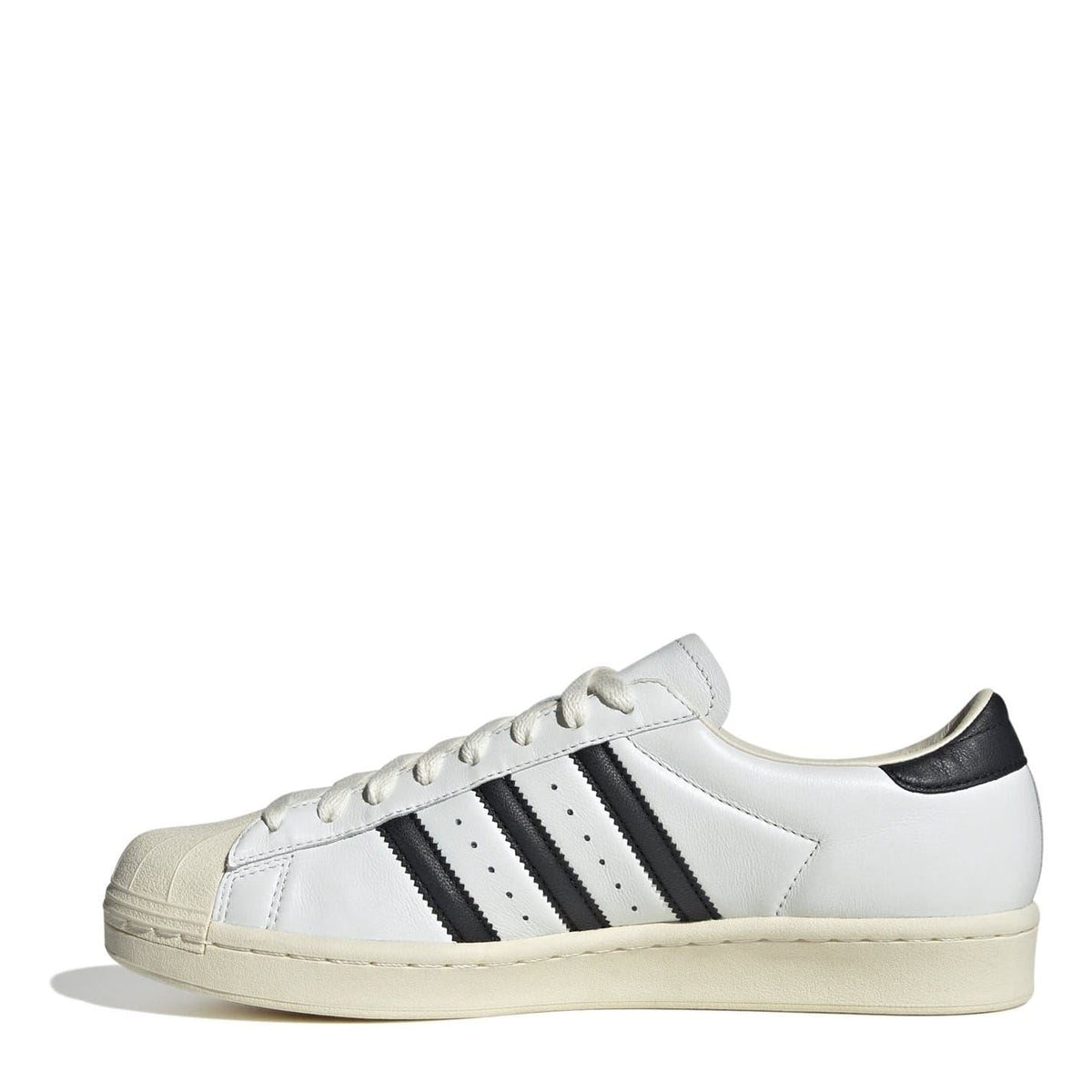 White/cream low-top sneakers with three black stripe panels and lace-up